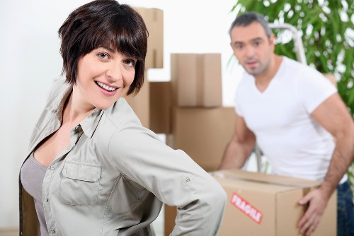 Piano removals team managing access and loading in Tottenham