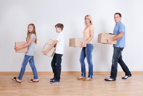 Professional team collecting old furniture from a property