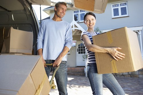 Local movers unloading household items at a Tottenham property