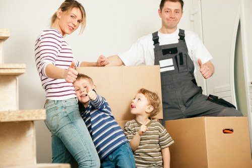A moving team preparing boxes and furniture for a house move in Tottenham